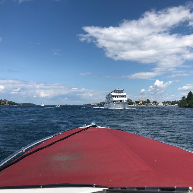 On the River Passing a Tour Ship